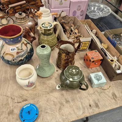 Lot 631 - A majolica and other jugs, a Chinese celadon...