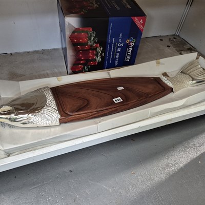 Lot 635 - A wooden salmon stand with chrome fish head...