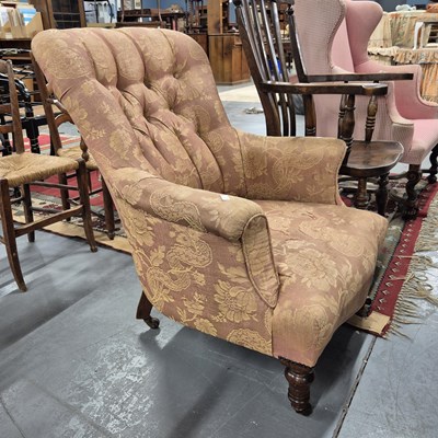 Lot 44 - A Victorian button back armchair.