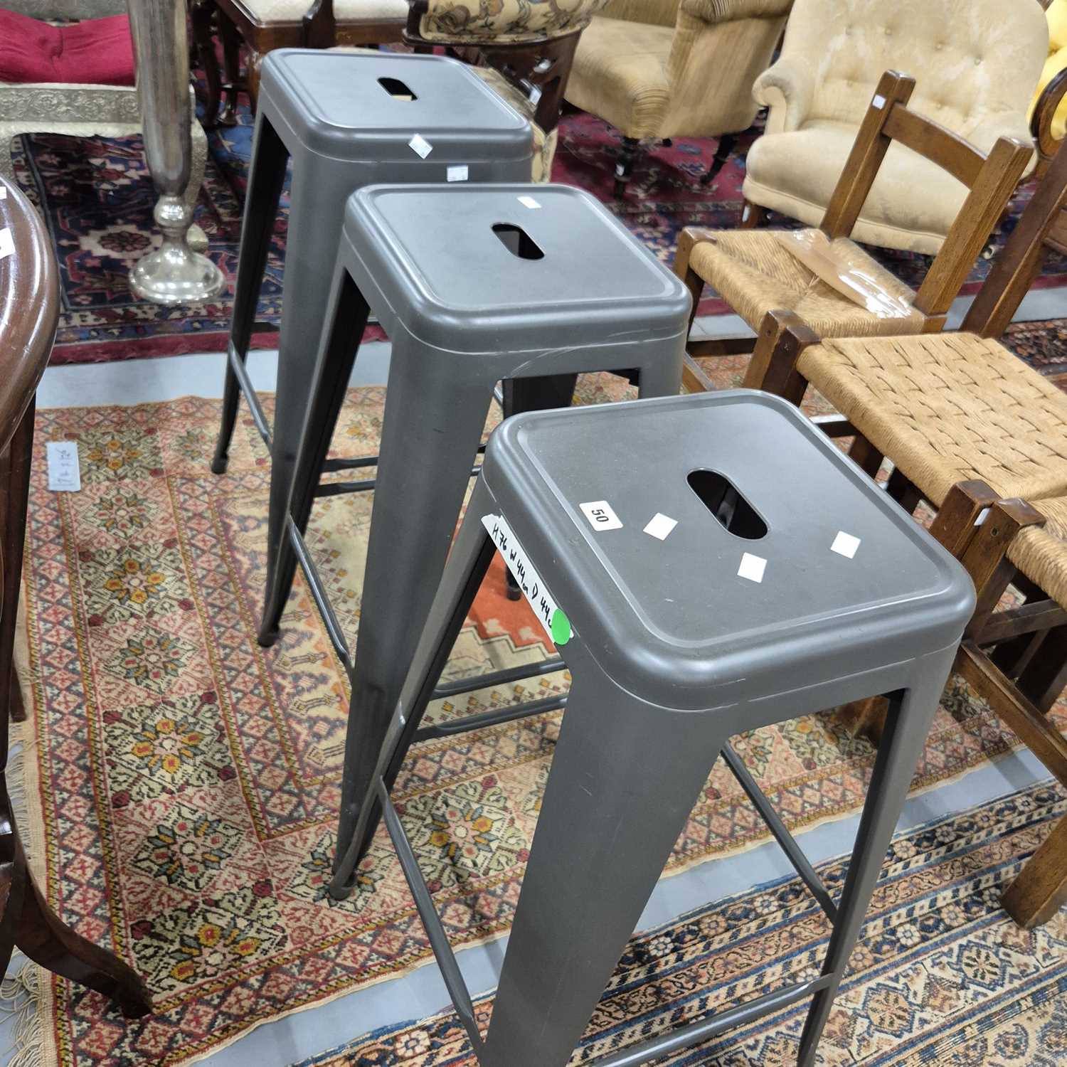 Lot 50 - Three steel stacking stools