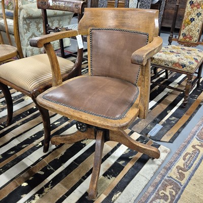 Lot 55 - An Edwardian oak swivel desk chair.