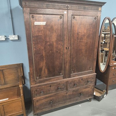 Lot 58 - An Early 19th century oak linen press with...