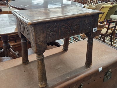 Lot 68 - An antique rustic oak stool