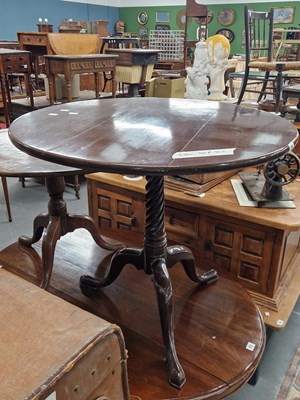 Lot 70 - A 19th century tripod table with spiral turned...