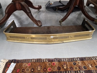 Lot 79 - A Victorian brass fire fender