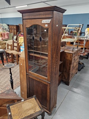 Lot 88 - A glazed oak cabinet