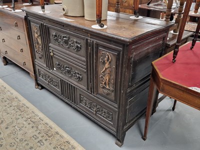 Lot 110 - A 19th century carved oak sideboard with...