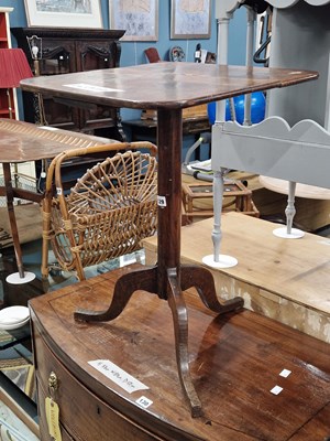 Lot 129 - A rustic oak country tripod table.