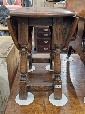 Lot 131 - An oak occasional table.