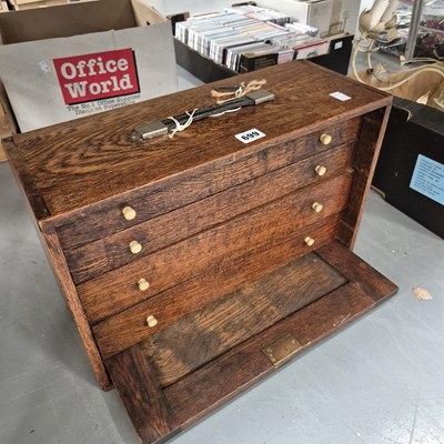 Lot 699 - An oak collector's chest of four drawers