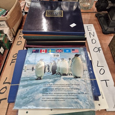 Lot 710 - Stamp albums together with souvenir coins and...