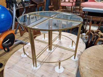 Lot 158 - A glass topped nest of four occasional tables