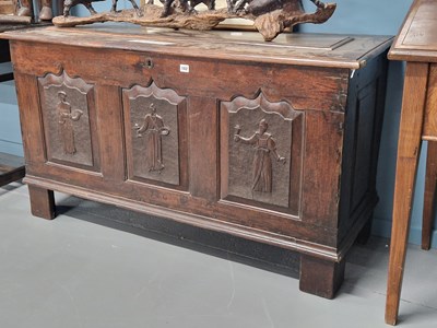 Lot 182 - An 18th century oak coffer with unusual carved,...