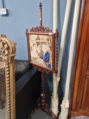 Lot 235 - A Victorian pole screen with pictorial...