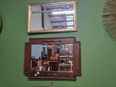 Lot 244 - An oak framed mirror and a water colour...