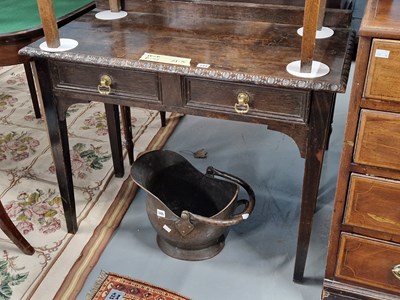 Lot 344 - An oak two drawer side table