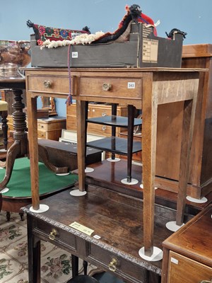 Lot 343 - A pale oak two-drawer side table with brass...