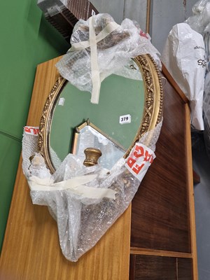 Lot 379 - A gilt-framed girandole wall mirror