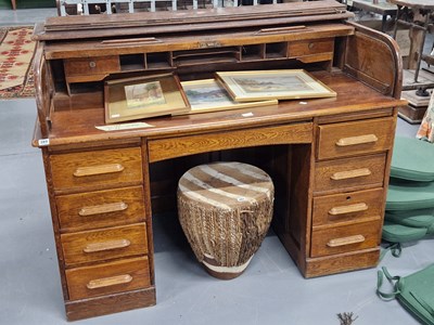 Lot 389 - A roll top desk.