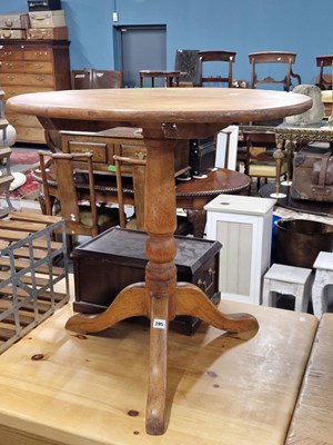 Lot 395 - A rustic oak tripod occasional table