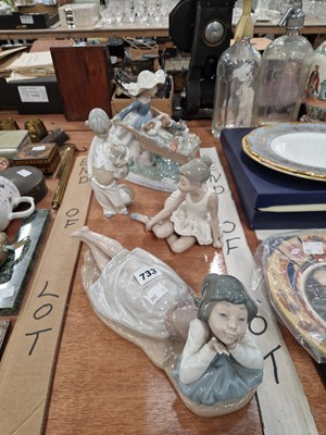 Lot 733 - Four Nao, Lladro and related figures