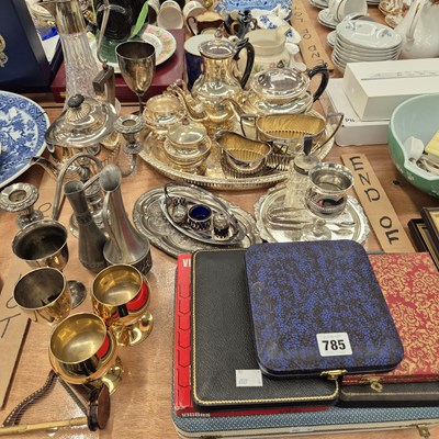 Lot 785 - An electroplate three- and a four-piece tea...