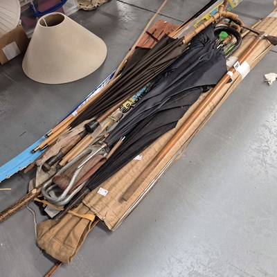Lot 797 - A rock climber's axe, walking sticks and...
