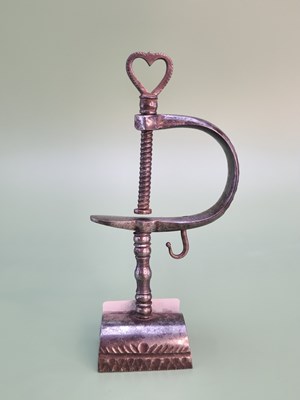 Lot 1289 - An early wrought iron sewing clamp