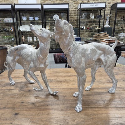 Lot 1290 - A pair of cast metal figures of standing Whippits