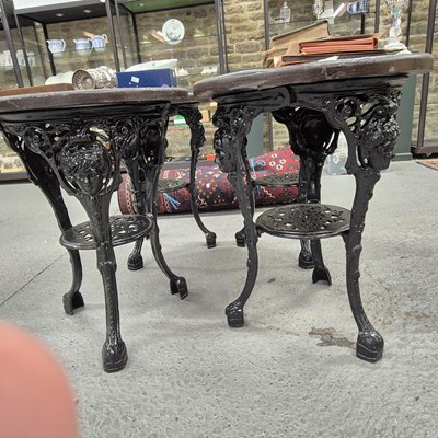 Lot 1298 - A pair of Vintage cast-iron-based round pub...