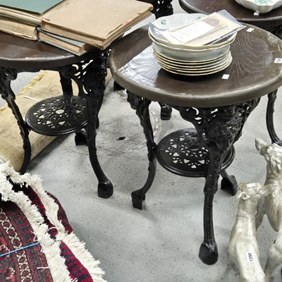 Lot 1299 - A pair of Vintage cast-iron-based round pub...