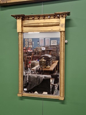 Lot 401 - An early 19th century pier mirror.