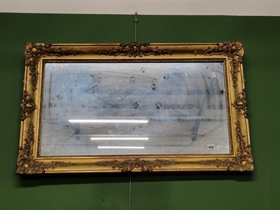 Lot 402 - A Victorian gilt-framed wall mirror.