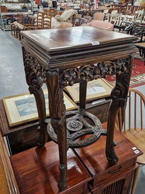 Lot 447 - An oriental carved hardwood plant stand