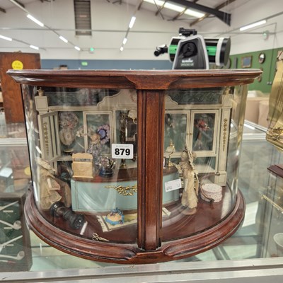 Lot 879 - A mahogany cased bow front diorama of a ...