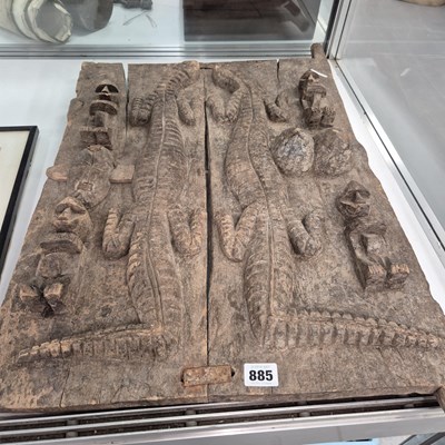 Lot 885 - An ethnic wooden relief panel of lizards and...