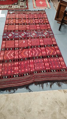 Lot 270 - A Tribal flat weave rug. 258 x 129cms