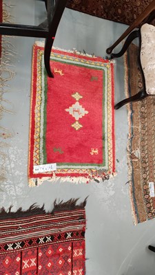 Lot 272 - A Tribal oriental mat 90 x 65cms