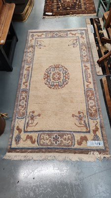 Lot 275 - A Tibetan rug of Chinese design 184 x 92cms
