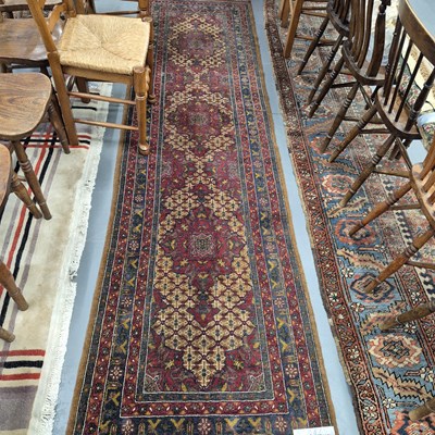 Lot 281 - A tribal oriental runner 332 x 88cms