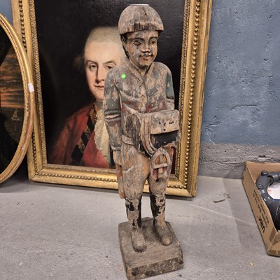 Lot 1310 - A carved wooden figure of a standing jockey