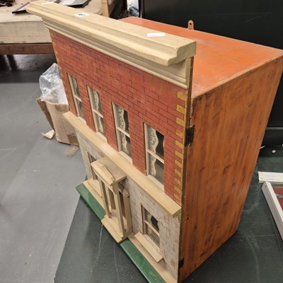 Lot 907 - A vintage front opening dolls house H 70cm
