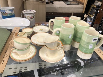 Lot 914 - Five Wilkinson Clarice Cliff ceramic tankards...