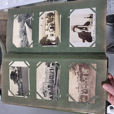 Lot 917A - A vintage postcard album also containing...