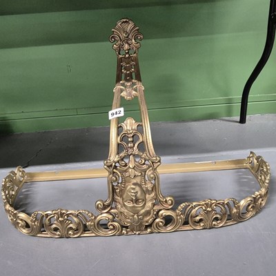 Lot 942 - A gilt cast metal console bracket