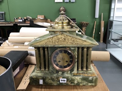 Lot 946 - A French onyx and gilt-mounted mantle clock....