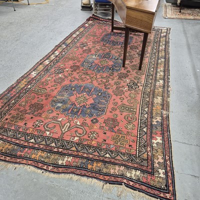 Lot 1333 - An antique Caucasian tribal rug, 363 x 194 cm