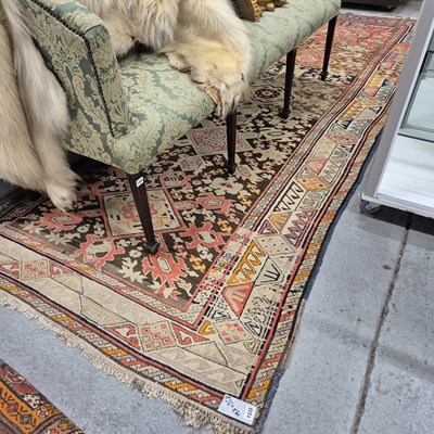 Lot 1332 - An antique Caucasian tribal rug, 358 x 157 cm