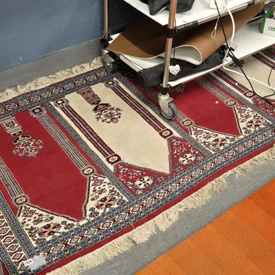 Lot 1335 - An unusual oriental prayer rug with multiple...