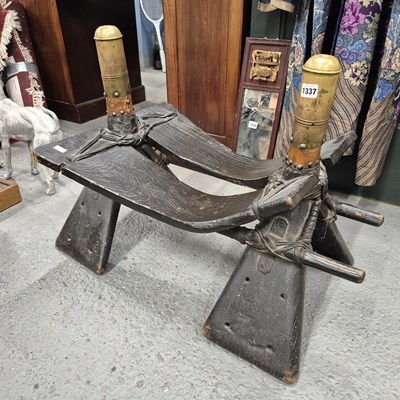Lot 1337 - An antique camel stool seat